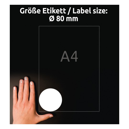 Obraz zobrazuje ruku vedle papíru formátu A4 s označením velikosti kruhového štítku Ø 80 mm na tmavém pozadí.
