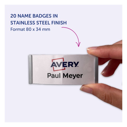 Obrázek zobrazuje ruku držící jmenovku se jménem 'Paul Meyer' a logem 'Avery'. Jmenovka je v provedení z nerezové oceli, měří 80 x 34 mm, a je uvedeno, že s tímto formátem je jich k dispozici 20.