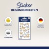 Obrázek zobrazuje sadu nálepek s dekorativními motivy motýlů se zlatými a stříbrnými efekty. Také uvádí, že produkt je vyroben v Německu.